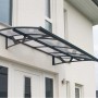 Graues Palram Canopia Vordach Amsterdam 1.4 x 2.2 m über einer Haustür.