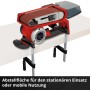 Einhell Akku-Bandschleifer TP-BS 18/457 Li BL Solo mit Staubfangbox und Schleifbändern auf Werkbank.