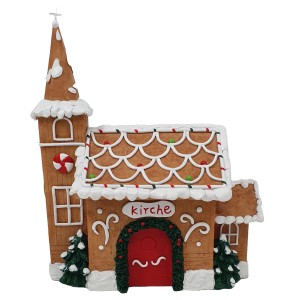 Dekorative Pfefferkuchen-Kirche, braun-bunt, als festliche Gartendekoration.