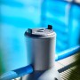 Summer Fun Solar-Pool-Kartuschenfilteranlage mit Solarmodul und blauen Schläuchen vor Pool.