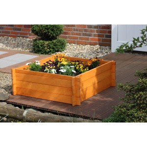 Holz-Hochbeet, 33,5x100x100 cm, bepflanzt mit bunten Blumen im Garten.