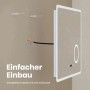 Emke LED Badspiegel 80x60cm bei der Wandmontage. Einfacher Einbau mit Zubehör, LED-Beleuchtung, Uhr und Touch-Schalter.