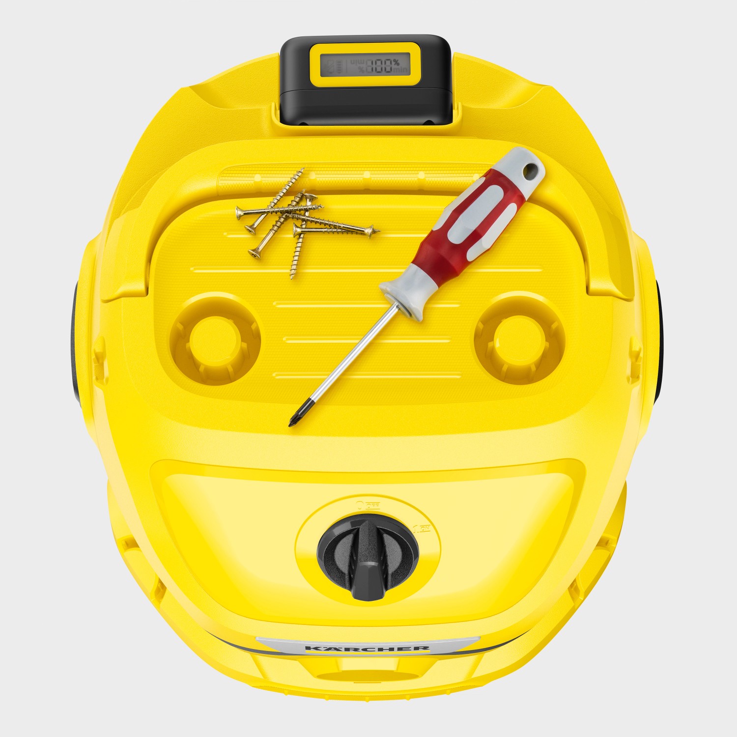 Gelber Kärcher Akku Nass-Trockensauger WD 2-18 mit Schraubendreher und Schrauben auf der Oberseite.