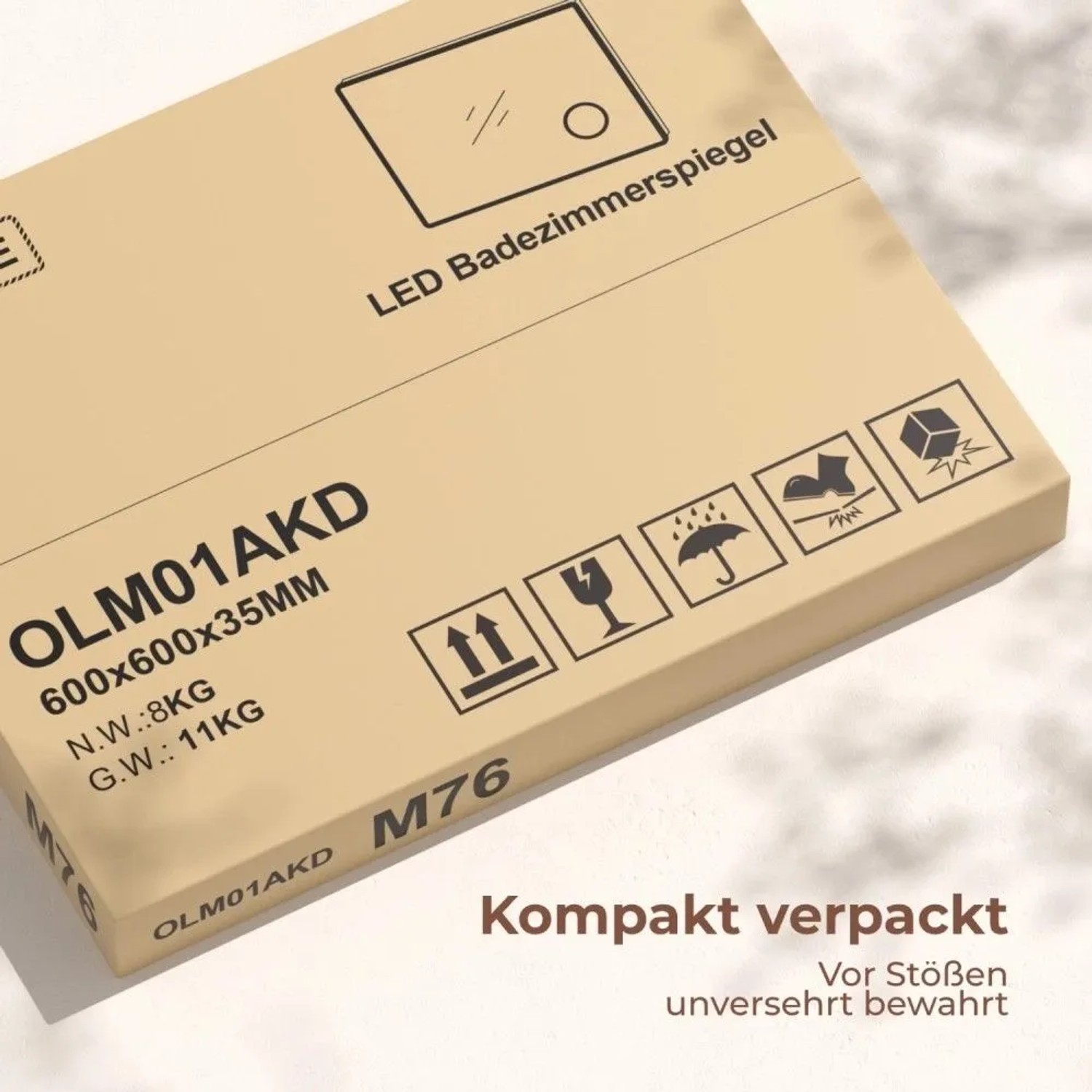 Braune Verpackung des Emke Rund Badezimmerspiegels 60cm mit Produktinfos, Maßen und Versandpiktogrammen.