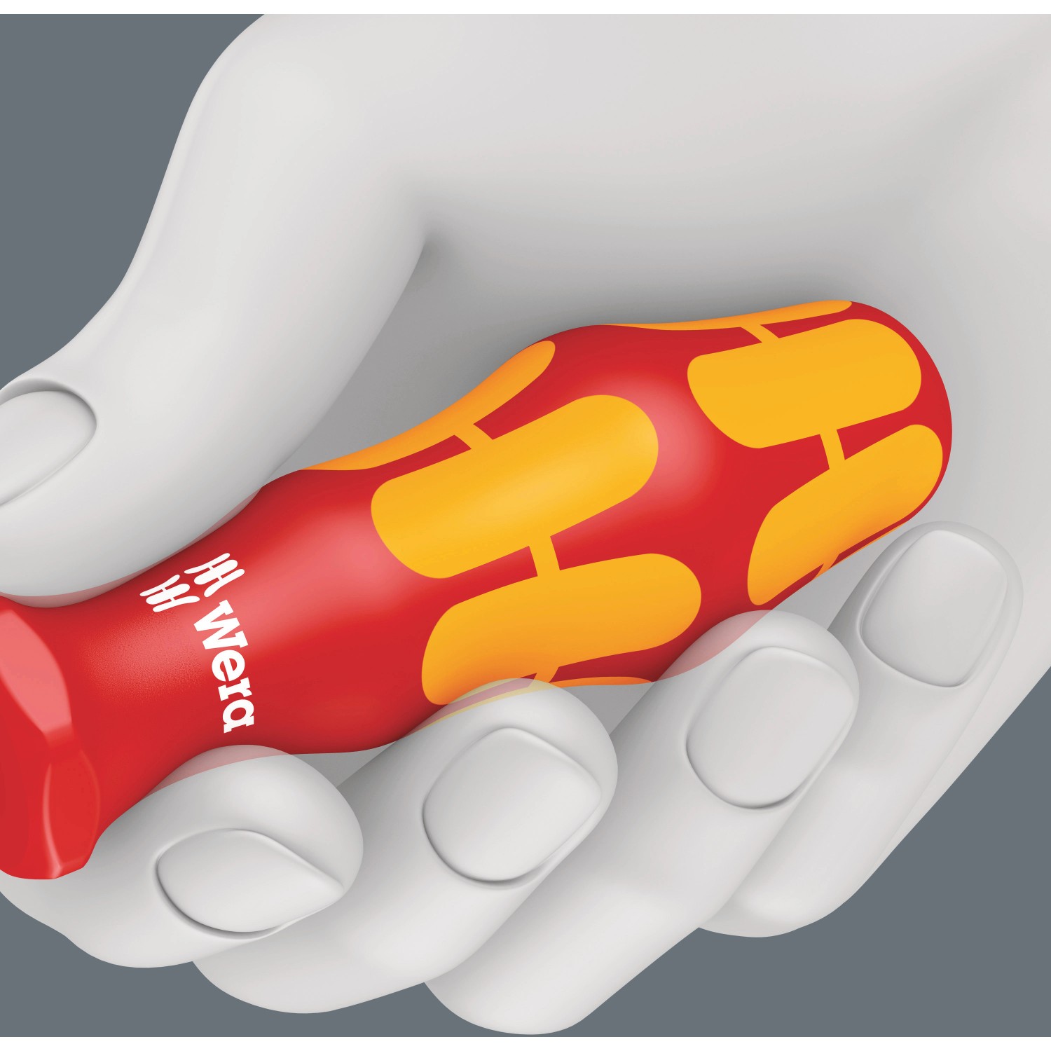 Wera isolierter Kreuzschlitz-Schraubendreher PH2, rot/gelb, in einer Hand gehalten.