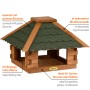Vogelhaus Blockhaus aus braunem Kiefernholz mit grünem Bitumendach. Großzügige Futterfläche für Garten, Terrasse.