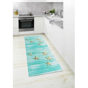 Mehrfarbige Wenko Badematte Mediaster, 65x200 cm, mit Seestern-Motiv in Küche.
