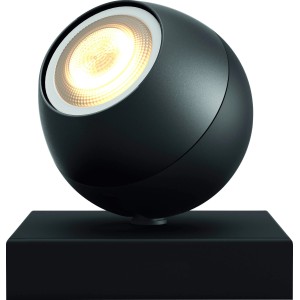 Schwarzer Philips Hue Spot Buckram mit warmweißem Licht auf eckigem Sockel.