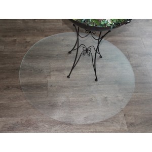 Transparente, runde Bodenschutzmatte (Ø 90 cm) unter einem Tisch auf Holzboden.