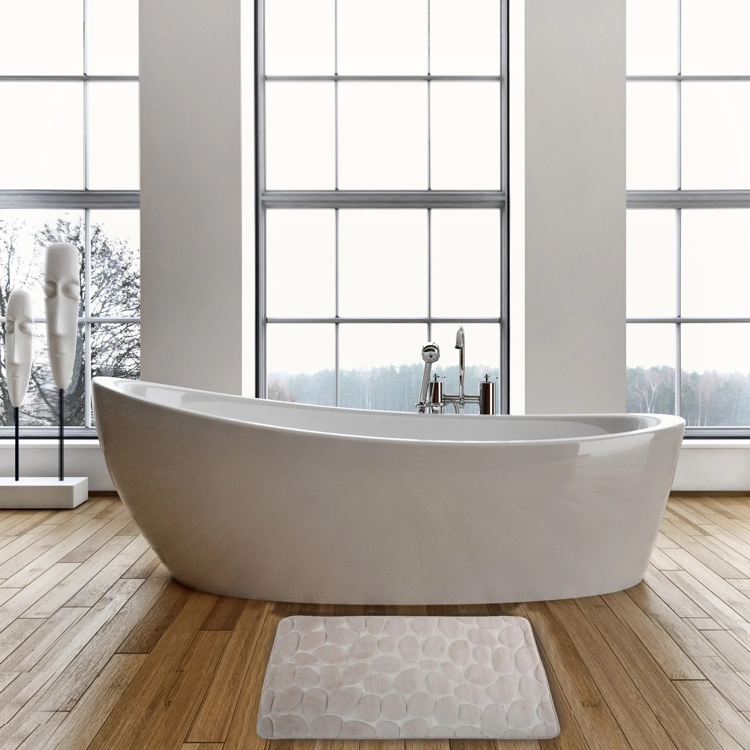 Beige MSV Badematte Kiesel (50x80 cm) im Badezimmer mit Badewanne und Holzboden.