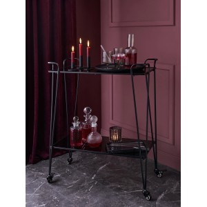 Schwarzer, runder Kerzenhalter aus Metall (Ø 7 cm, 9 cm hoch) auf einem Servierwagen dekoriert.