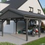 Skan Holz Carport Fichtelberg, schiefergrau, mit Auto und Motorrad untergestellt.