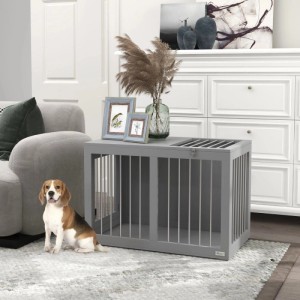 Grauer PawHut Hundekäfig für mittelgroße Hunde im Wohnzimmer. Moderne Hundebox mit Türen, auch als Beistelltisch nutzbar.