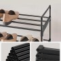 Detailaufnahme: Schwarzes Songmics Schuhregal Deky mit 4 Ebenen und Schuhen, Fokus auf Rohre und Verbinder.