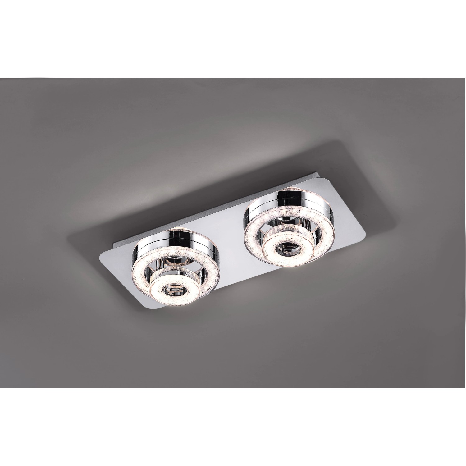 Moderne LED-Deckenleuchte Tim Chrom, 40x17 cm, mit zwei dreh- und schwenkbaren Leuchtringen in Kristalloptik.