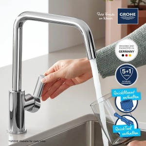 Grohe QuickFix Spültischarmatur Start mit U-Auslauf in Chrom, Wasserhahn wird bedient.