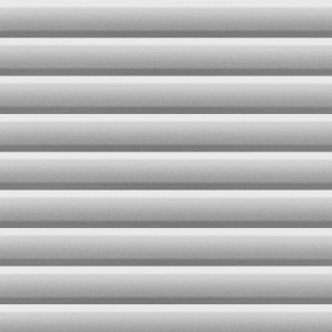 Detailaufnahme: Weißes Velux Solar-Verdunkelungsrollo für Flachdachfenster.