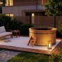 Finntherm Holz-Badefass Bergen, Ø 180 cm, aus nordischer Fichte mit Leiter im Garten.