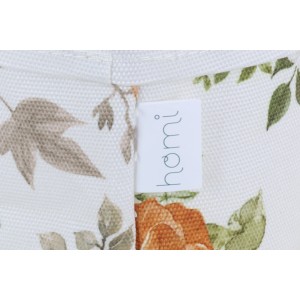 Detailansicht: Weißer Pflanzkorb (Ø 15cm) mit Blumenmuster und Homi Logo.