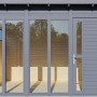 Anthrazitfarbenes Bertilo Gartenhaus Pentus 3 Office mit Fensterfront und Tür.