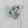 Wenko Turbo-Loc Haartrocknerhalter aus glänzendem Edelstahl mit Haartrockner an weißer Wand.