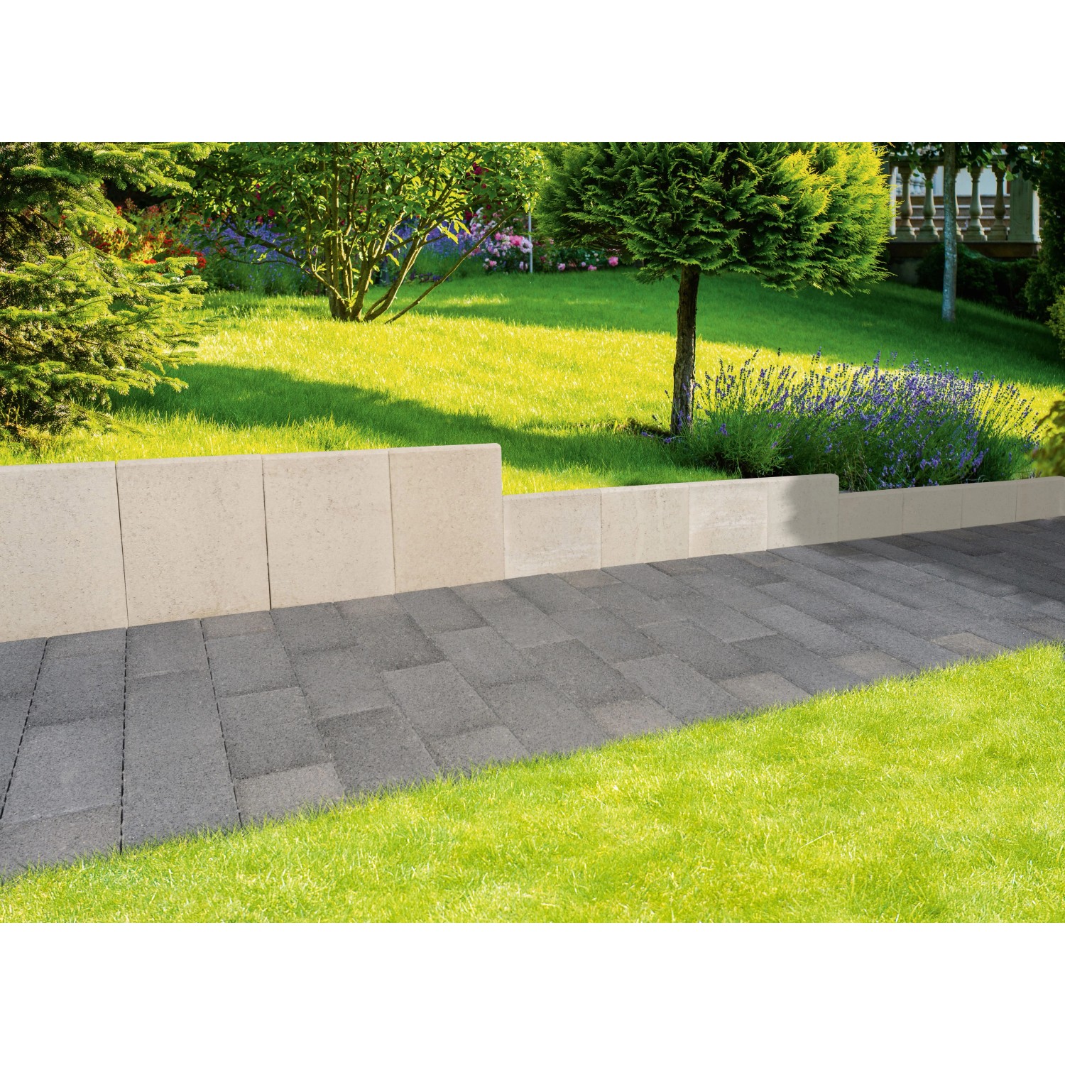Graue EHL L-Steine unbewehrt (60x40x30 cm) als Beet- und Raseneinfassung im Garten.