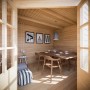 Innenansicht Carlsson Gartenhaus Hanna-40: Holzhaus mit Esstisch und Stühlen.