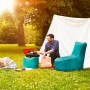 Sitting Point Sessel Swing Anthrazit im Garten mit Zelt, Plattenspieler und entspannten Personen.