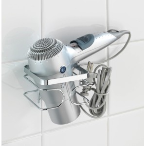 Wenko Haartrocknerhalter Premium aus Edelstahl, glänzend, mit Fön an weißer Wand.