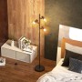 Moderne HOMCOM Stehlampe aus schwarzem Metall mit drei verstellbaren E27 Leuchten und geometrischen Schirmen im Schlafzimmer.