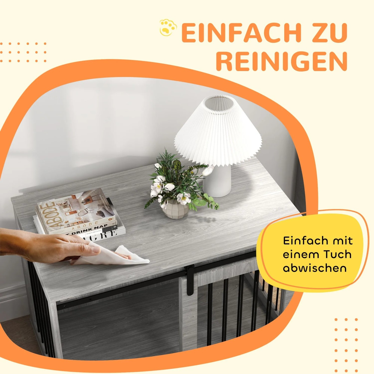 Hand wischt graue Holzoptik-Oberfläche des PawHut Hundekäfigs ab. Leichte Reinigung der robusten Hundebox.