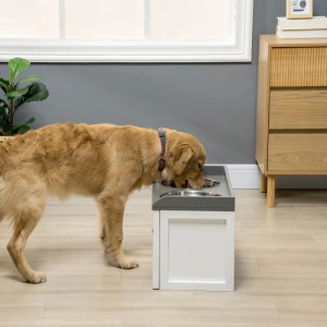 Großer Golden Retriever frisst aus erhöhtem PawHut Hundenapf mit 2 Edelstahlschalen und Schublade.