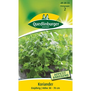 Packung Quedlinburger Koriander 'Thüringer' Kräutersamen mit grünen Korianderblättern.
