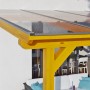 Skan Holz Terrassenüberdachung Andria aus hellem Leimholz Eiche mit transparenten Polycarbonatplatten.