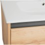 Detailaufnahme Badmöbel-Set Cleo: Waschbeckenunterschrank in Holzoptik mit Schublade und Keramikwaschbecken.