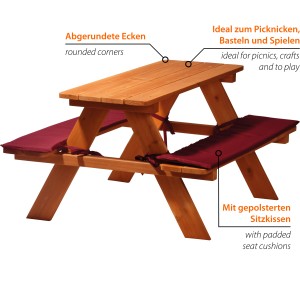 Kinder-Sitzbank aus Holz mit roten Sitzkissen für vier Kinder. Ideal zum Spielen und Picknicken.
