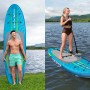 Bestway SUP Board Aqua Journey Set, blau/grün, mit Paddel und Person auf dem Wasser.