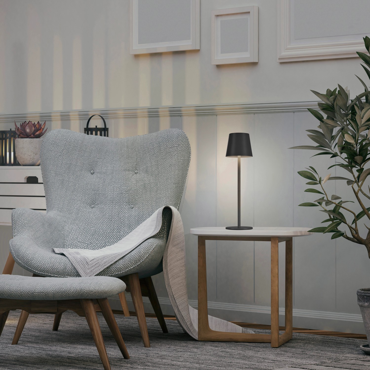 Schwarze LED-Akku-Tischleuchte Euria von Just Light auf Beistelltisch im Wohnzimmer.