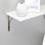 OBI Konsole Kottos in Antik-Silber mit weißem Regalbrett, Vase und Bilderrahmen an grauer Wand.