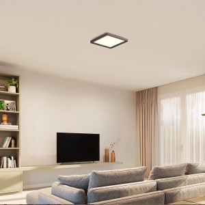 Quadratische Philips Hue LED-Deckenleuchte Tento White Ambiance S, schwarzer Rahmen, in Wohnraum.