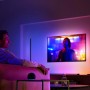 Philips Hue Lightstrip Gradient Ambience 1m Erweiterung im Wohnzimmer mit farbigem Licht.