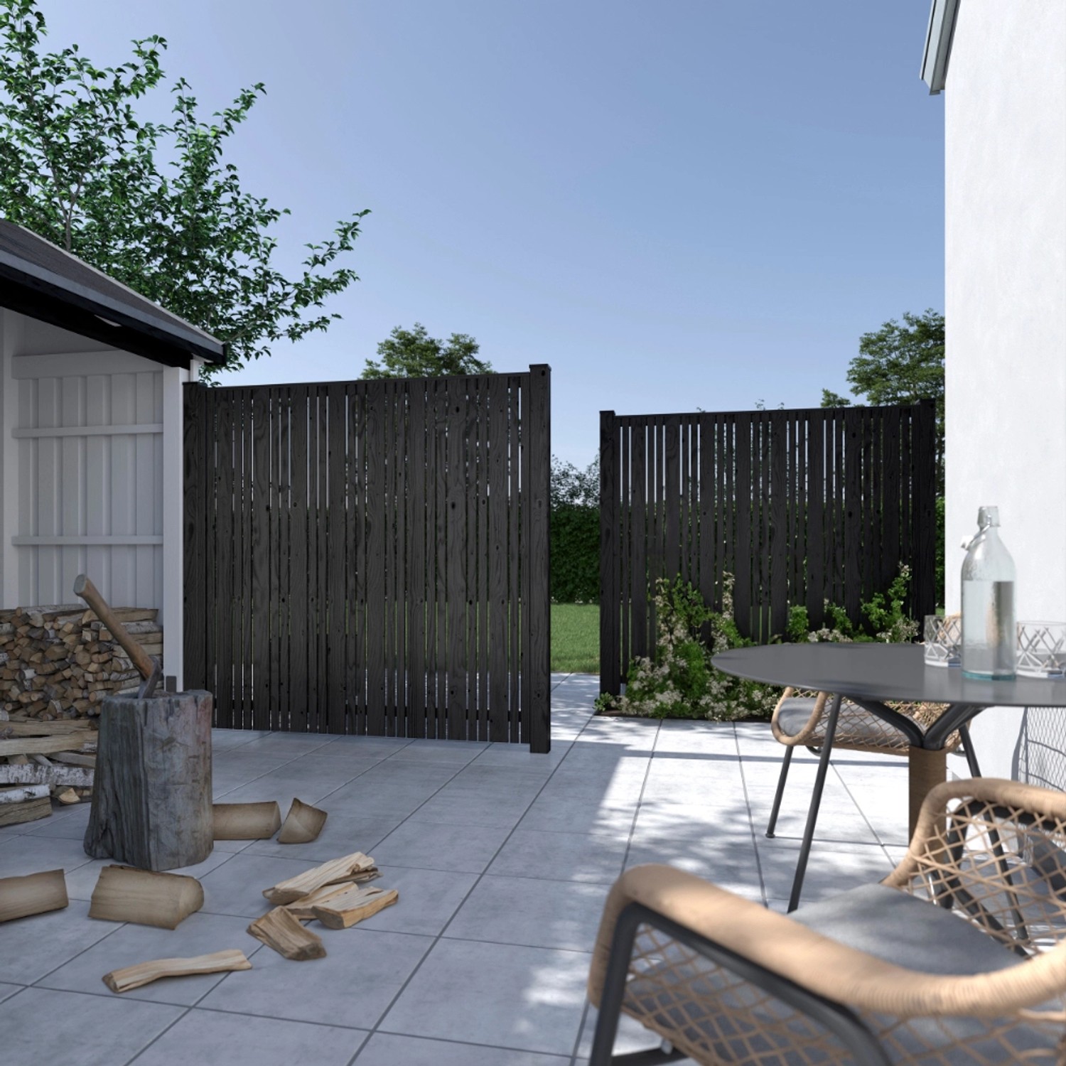 Schwarzer Sichtschutzzaun Tangent aus Nadelholz, 180x180 cm, im Garten.