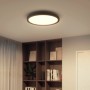 Schwarze Philips Hue Aurelle LED-Panelleuchte (Ø 39,5 cm) an Zimmerdecke.