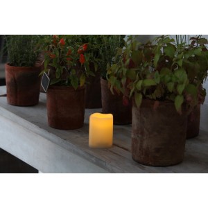 Cremefarbene LED Outdoor Kerze Piccolo aus Kunststoff, 7,5x10cm, mit Fernbedienung.