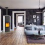 Schwarzer Fireplace Adelaide Kaminofen (6 kW) mit Keramikverkleidung im Wohnraum.