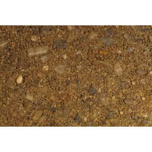 Nahaufnahme von beigem Betonschotter (0-16 mm) im PE-Sack, ideal als Zuschlagstoff für Beton.