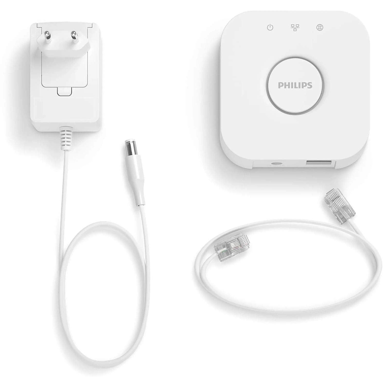 Weiße Philips Hue Bridge mit Netzteil und LAN-Kabel zur Steuerung von Hue Leuchten.