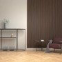 Denpanels Akustikpaneel Acu-Line Walnuss an Wand im Wohnraum. Holzpaneel zur Schallreduzierung.