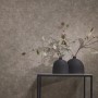 A.S. Creation Vliestapete in Grau-Braun mit leichter Struktur-Optik an der Wand.