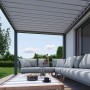 Biohort Pergola in Dunkelgrau/Silber-Metallic mit Lamellendach und Sitzgruppe auf der Terrasse.